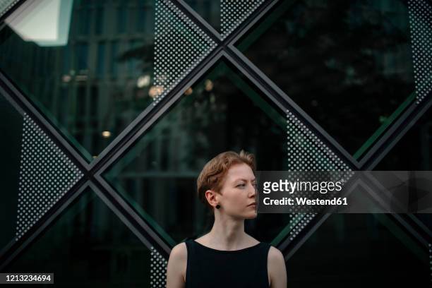portrait of urban red-haired woman - high contrast bildbanksfoton och bilder