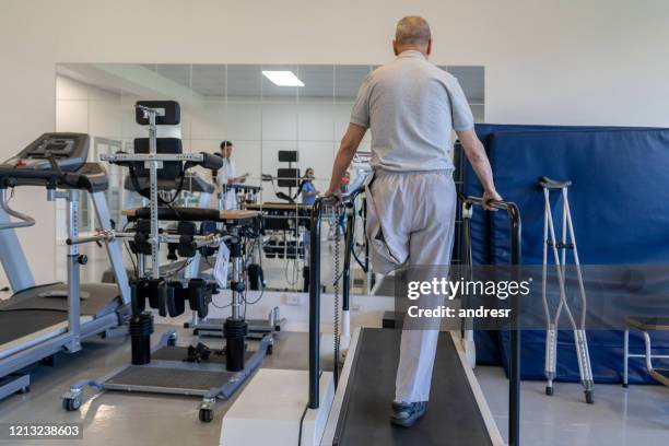 disabled senior man doing physical therapy - amputee rehab stock pictures, royalty-free photos & images