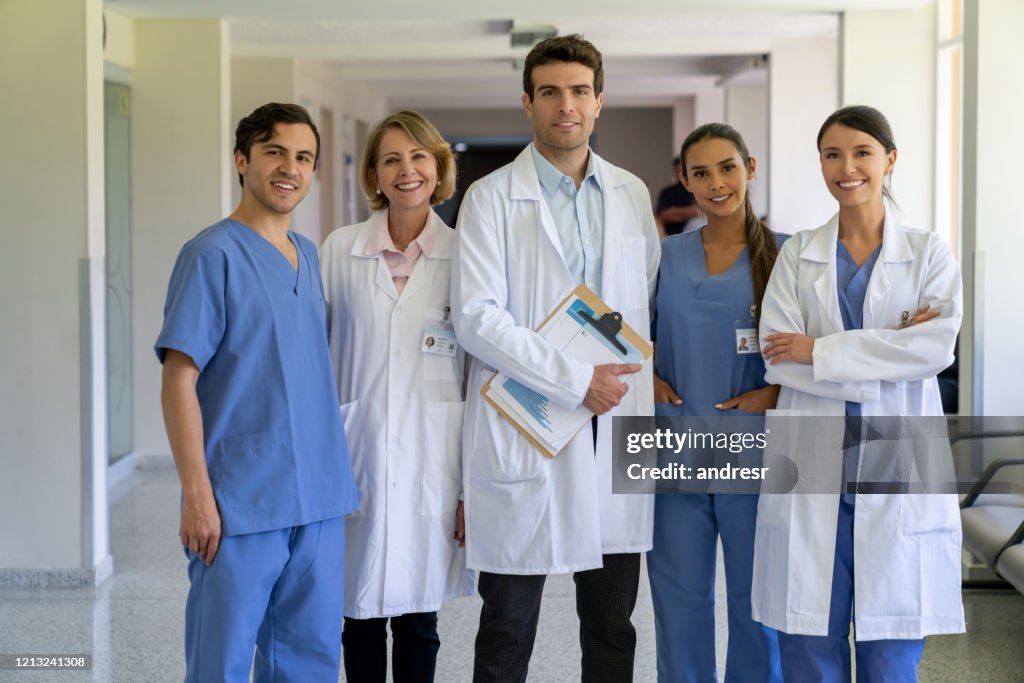 Happy group of doctors at the hospital