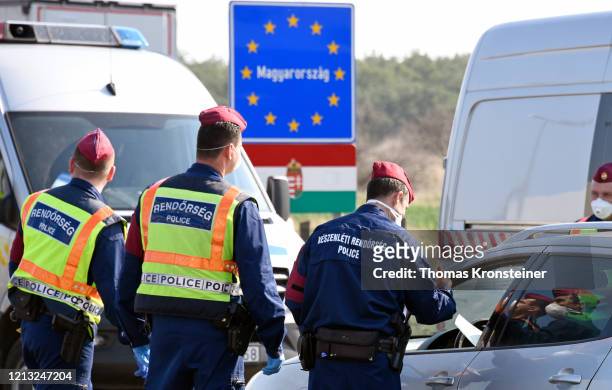 Hungarian police checks cars at the Austrian-Hungarian border crossing in Nickelsdorf on March 18, 2020 in Nickelsdorf, Austria. After negotiations...