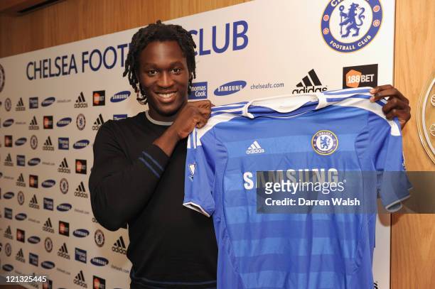 Chelsea new signing Romelu Lukaku poses in the Chelsea shirt at Cobham training ground on August 18, 2011 in Cobham, England.