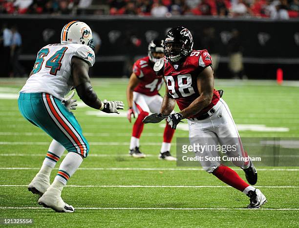 Cliff Matthews of the Atlanta Falcons rushes the passer against Ray Willis of the Miami Dolphins during a preseason game at the Georgia Dome on...
