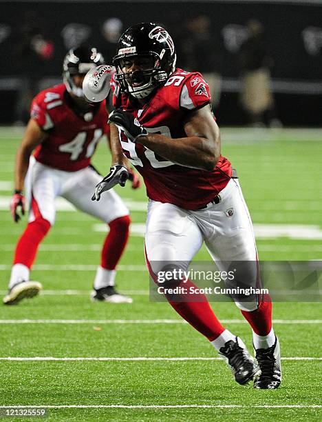 Cliff Matthews of the Atlanta Falcons rushes the passer against the Miami Dolphins during a preseason game at the Georgia Dome on August 12, 2011 in...