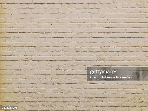 light beige painted brick wall - beige brick stock pictures, royalty-free photos & images