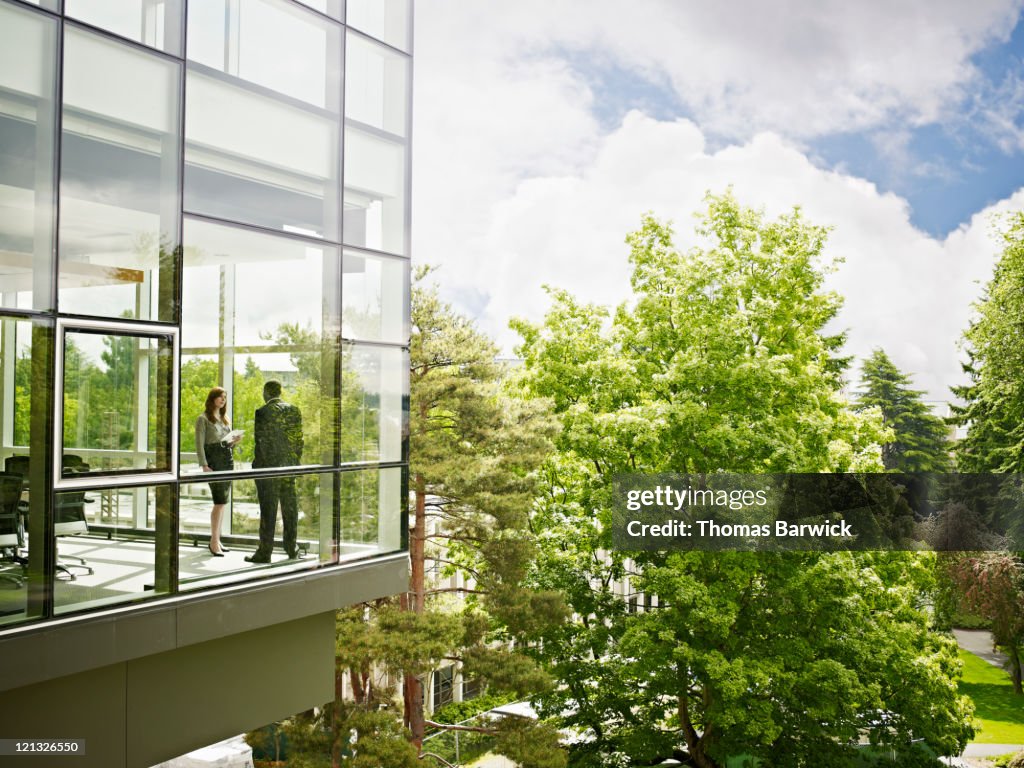 Coworkers in conference room view from outside