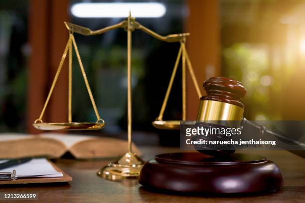 justice scales and wooden gavel. justice concept - gevel stock-fotos und bilder