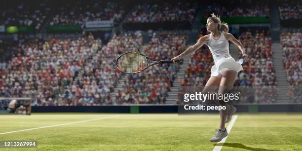 professional tennis player in mid motion after serving on grass - tennis outfit stock pictures, royalty-free photos & images