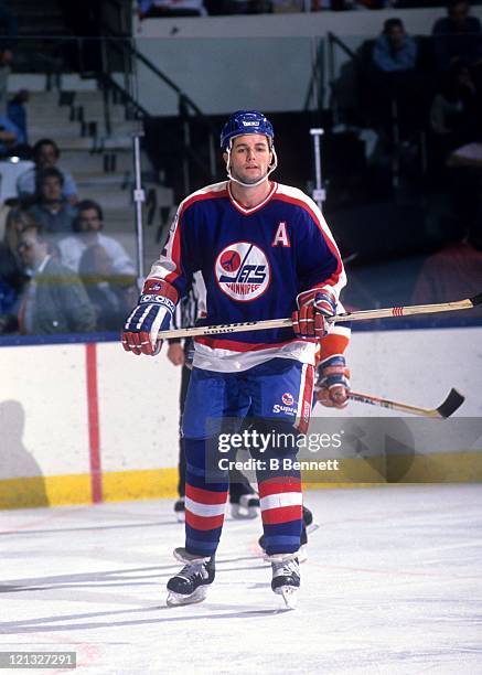 Dave Ellett of the Winnipeg Jets skates on the ice during an NHL game against the New York Islanders on November 1, 1988 at the Nassau Coliseum in...
