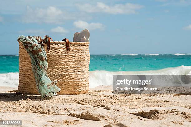 beach bag on sandy beach, mustique, grenadine islands - tote bags stock pictures, royalty-free photos & images