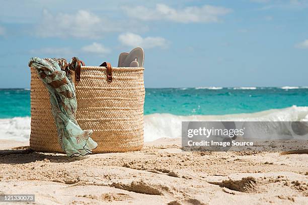beach bag on sandy beach, mustique, grenadine islands - sarong imagens e fotografias de stock