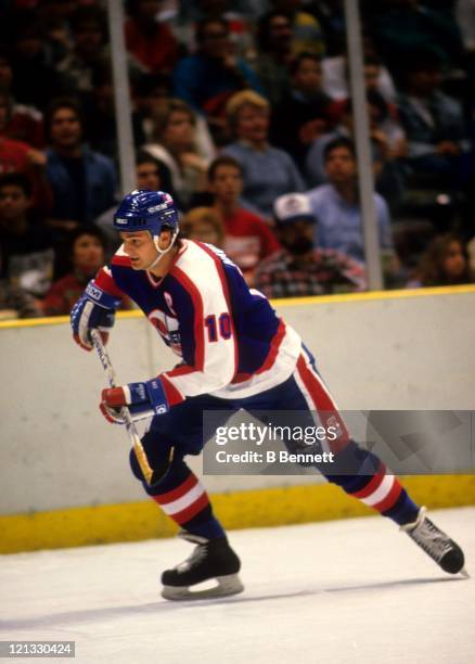 Dale Hawerchuk of the Winnipeg Jets skates on the ice during an NHL game against the New Jersey Devils circa 1988 at the Brendan Byrne Arena in East...