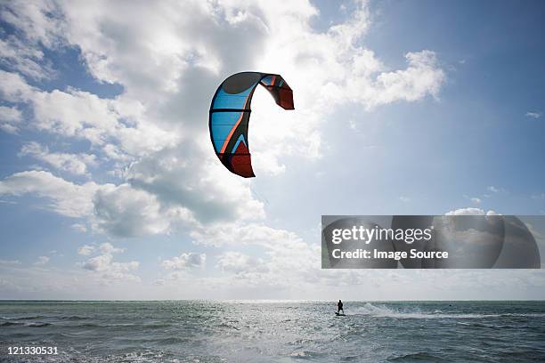 young man kitesurfing - kiteboard stockfoto's en -beelden