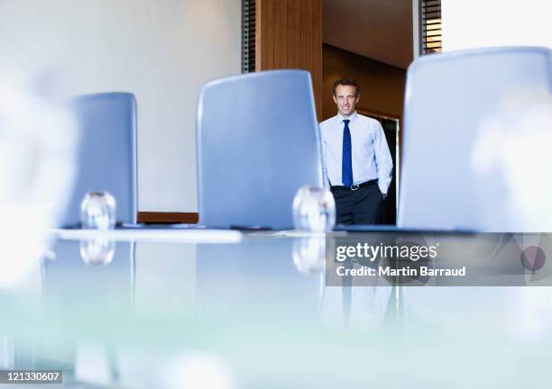 businessman entering conference room - chairperson stock pictures, royalty-free photos & images