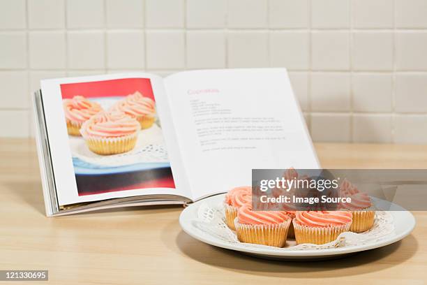 cupcakes and cookery book - cookbook stock pictures, royalty-free photos & images