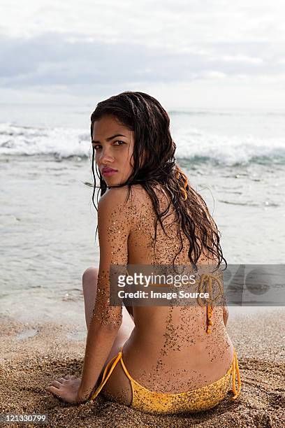 woman sitting on beach - hot puerto rican women stock pictures, royalty-free photos & images