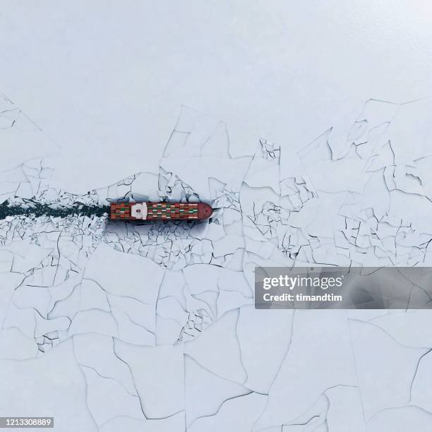 container ship breaking ice - ship photos et images de collection