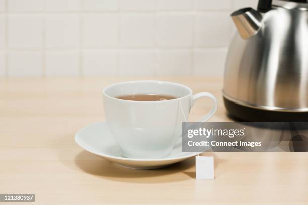 teacup and kettle - tea cup stock pictures, royalty-free photos & images