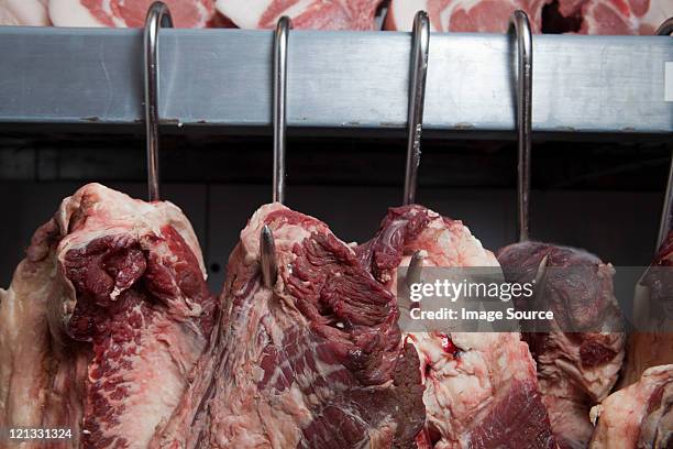 beef hanging - slaughterhouse stock pictures, royalty-free photos & images