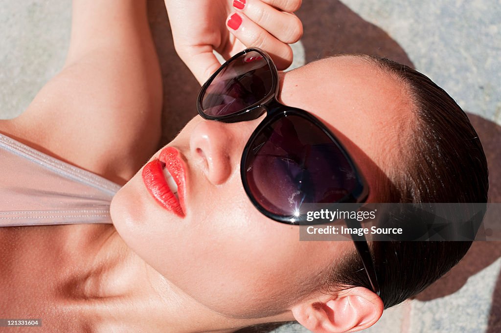 Woman wearing sunglasses, close up
