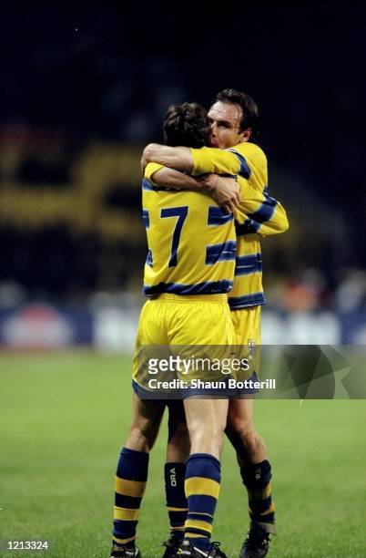 Diego Fuser and Alain Boghossian of Parma celebrate during the UEFA Cup Final against Marseille played in Moscow, Russia. The match finished in a 3-0...