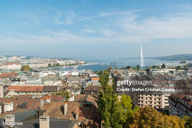 geneva cityscape and the jet d'eau on geneva lake, switzerland - geneva switzerland stock pictures, royalty-free photos & images