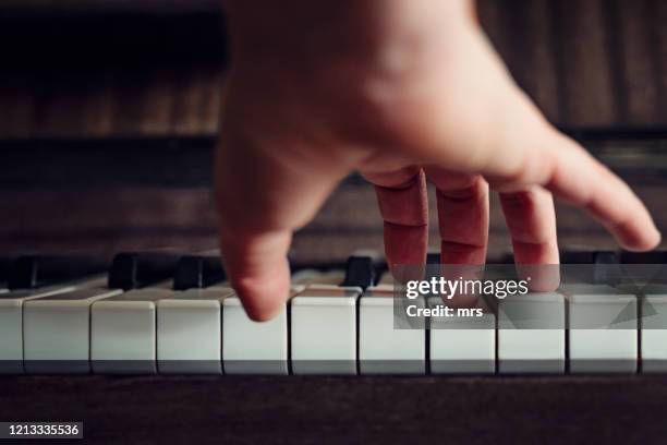 playing piano - piano key stock pictures, royalty-free photos & images