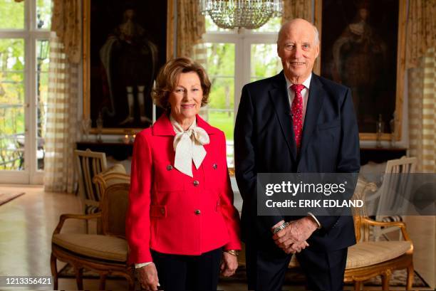 Queen Sonja of Norway and King Harald of Norway pose in the garden room of the royal estate in Oslo, Norway on May 16 on the eve of the Norwegian...