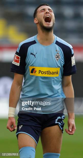 Ramy Bensebaini of Borussia Moenchengladbach celebrates after scoring his sides third goal, from a penalty, during the Bundesliga match between...