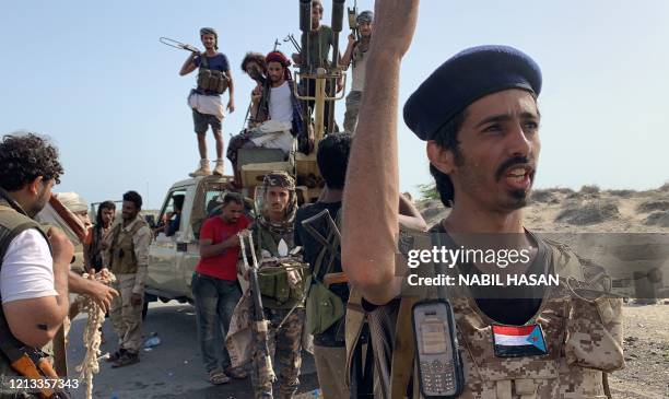 Fighters loyal to Yemen's Southern Transitional Council separatists gather at the frontline during clashes with pro-government forces for control of...