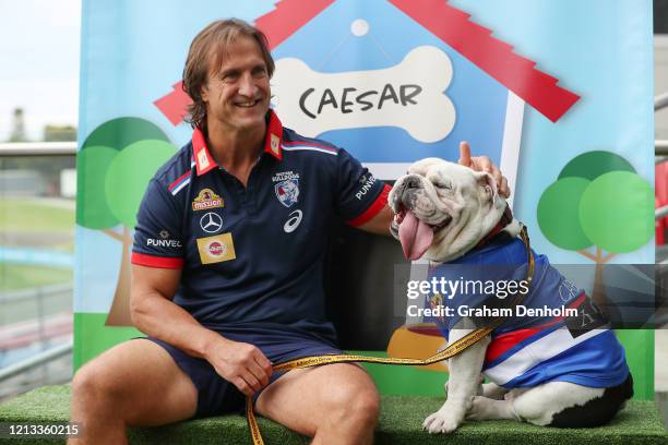 Western Bulldogs head coach Luke Beveridge poses with club mascot Caesar during a Western Bulldogs AFL media opportunity at Whitten Oval on March 19,...