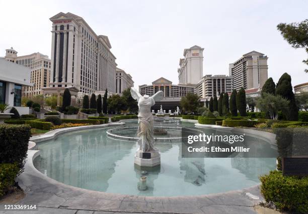 An exterior view shows Caesars Palace with its fountains along the Las Vegas Strip turned off as the coronavirus continues to spread across the...