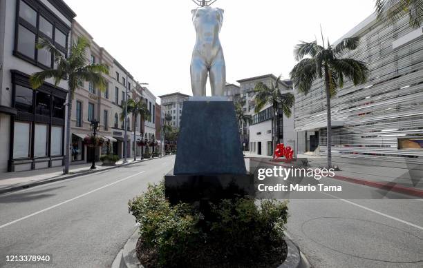 The sculpture 'Torso' by Robert Graham stands on iconic and nearly empty Rodeo Drive on March 18, 2020 in Beverly Hills, California. The city of...