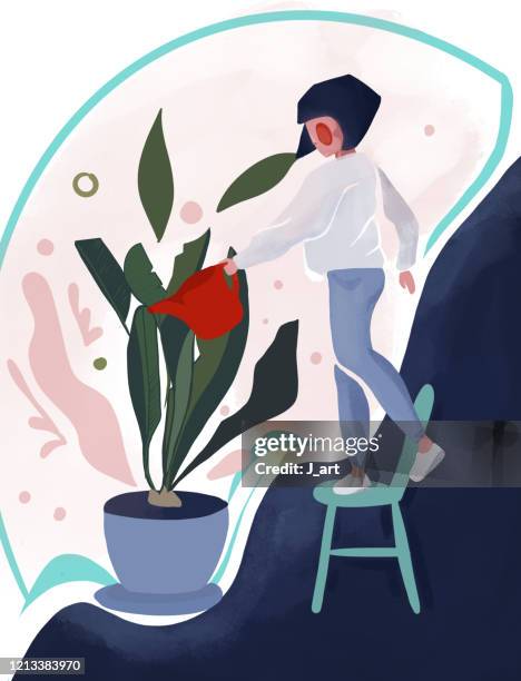 Beautiful girl caring for her plants. Plants growing in pots.