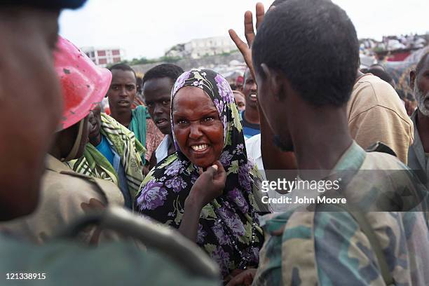 Woman complains about lack of food aid at a camp for Somalis displaced by drought and famine on August 18, 2011 in Mogadishu, Somalia. The UN...