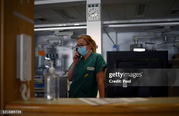 Pharmacist Susan Holgate talks on the telephone in the Critical Care Unit at The Royal Blackburn Teaching Hospital in East Lancashire, during the...