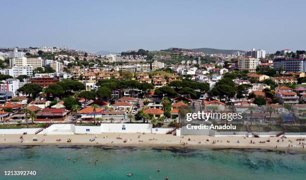 Drone photo shows an aerial view of a beaches open for swimming within social distancing as part of the precautions against the novel coronavirus...