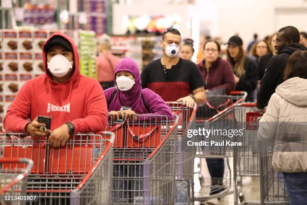 Shoppers line the aisles at Costco Perth on March 19, 2020 in Perth, Australia. The store, which is the first Costco in Western Australia, is...
