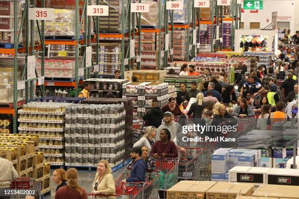 Shoppers line the aisles at Costco Perth on March 19, 2020 in Perth, Australia. The store, which is the first Costco in Western Australia, is...