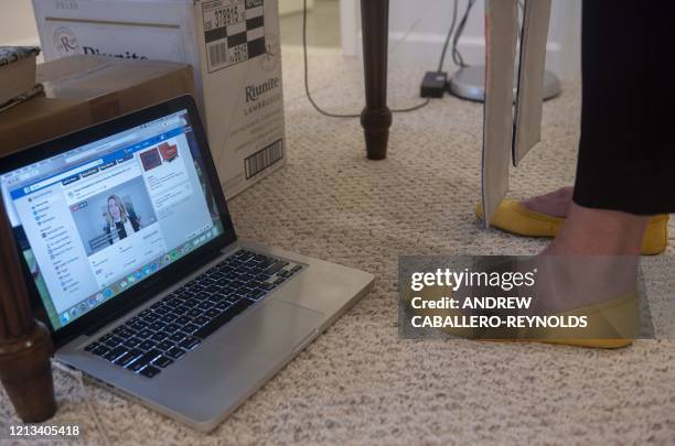 Reverend Sarah Scherschligt, Pastor at the Peace Lutheran church, is seen on Facebook Live as she holds an online streaming service from the basement...