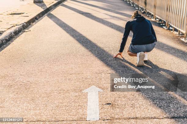 back view of athlete runner woman in start position ready for sprint or running. - hot body girls stock pictures, royalty-free photos & images