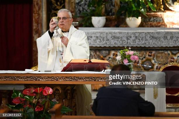 Italian bishop Francesco Micciche celebrates mass at the church of Santa Maria in Traspontina in Rome on May 18, 2020 during the country's lockdown...