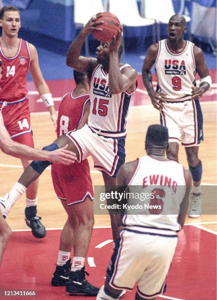 Magic Johnson of the United States drives to the basket in the men's basketball final against Croatia at the Barcelona Olympics in August 1992, with...