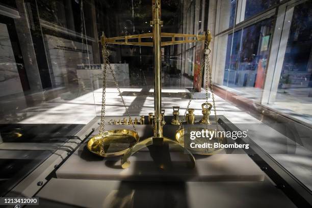 Gold scales are displayed in the deserted foyer of the Reserve Bank of Australia building during a partial lockdown imposed due to the coronavirus,...