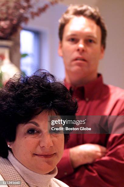 Michael Sweeney and Lauren Rosenzweig, shown here at Lauren's home, both lost their spouses in the 9/11 disasters.