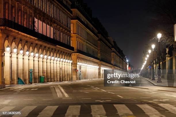 Deserted "rue de Rivoli" is seen at night the third day after the announcement by French President Emmanuel Macron of the confinement of the French...