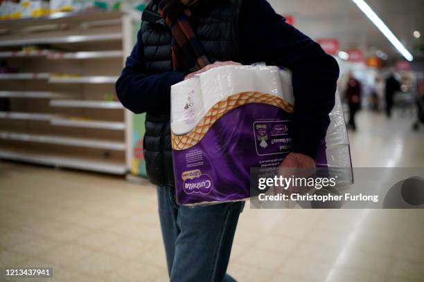 Senior citizens shop at Sainsbury's Supermarket on March 19, 2020 in Northwich, United Kingdom. A queue of approximately 600 old age pensioners...