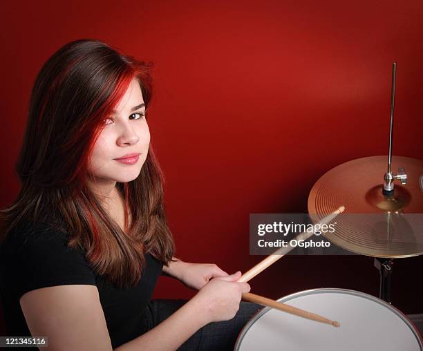 teen girl playing drums - brown hair with highlights stock pictures, royalty-free photos & images