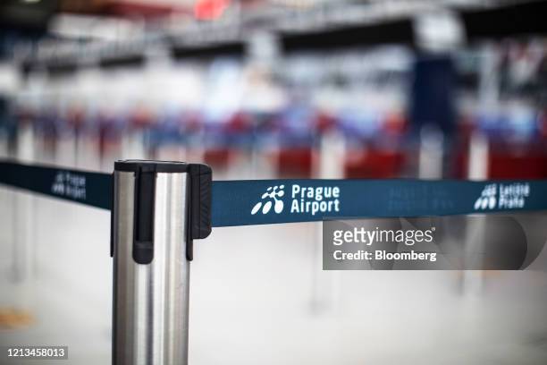 Passenger cordon stands in an empty check-in area at Vaclav Havel Airport in Prague, Czech Republic, on Monday, May 18, 2020. Residents of the Czech...