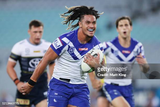 Renouf To'omaga of the Bulldogs runs away to score a try during the round 2 NRL match between the Canterbury Bulldogs and the North Queensland...