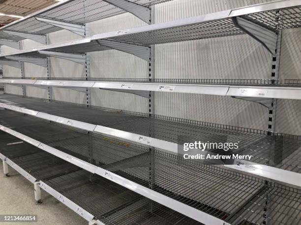 coronavirus, covid-19 pandemic, empty supermarket shelves from panic buying - panic buying - fotografias e filmes do acervo